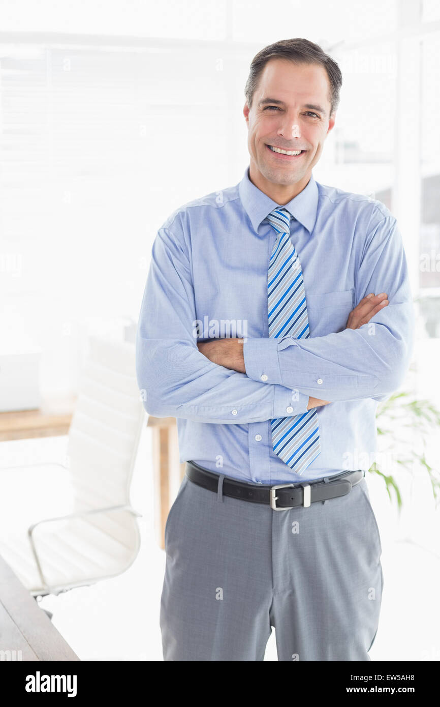 Smiling businessman looking at camera Stock Photo - Alamy