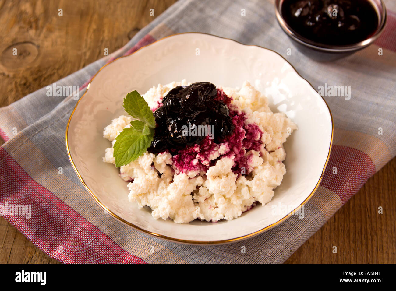 Cottage cheese with blueberry jam and mint in a bowl Stock Photo Alamy