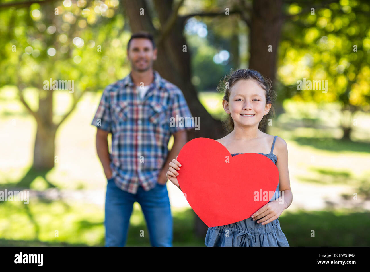 Father and daughter smiling in the park Stock Photo - Alamy