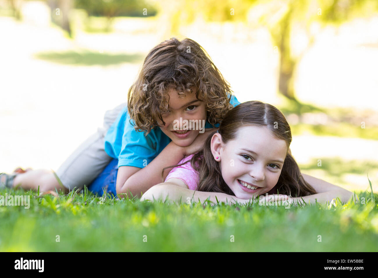 Little siblings smiling at camera Stock Photo