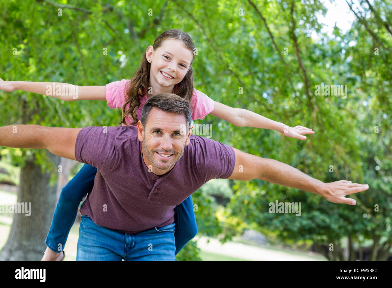 Father and daughter having fun in the park Stock Photo - Alamy