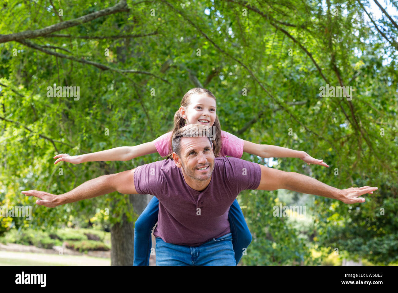 Father and daughter having fun in the park Stock Photo - Alamy