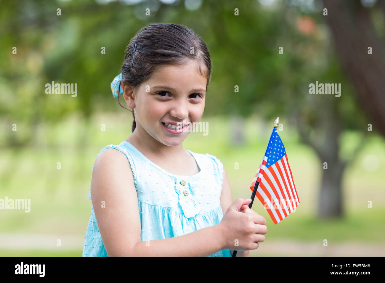Little girl waving american flag Stock Photo - Alamy