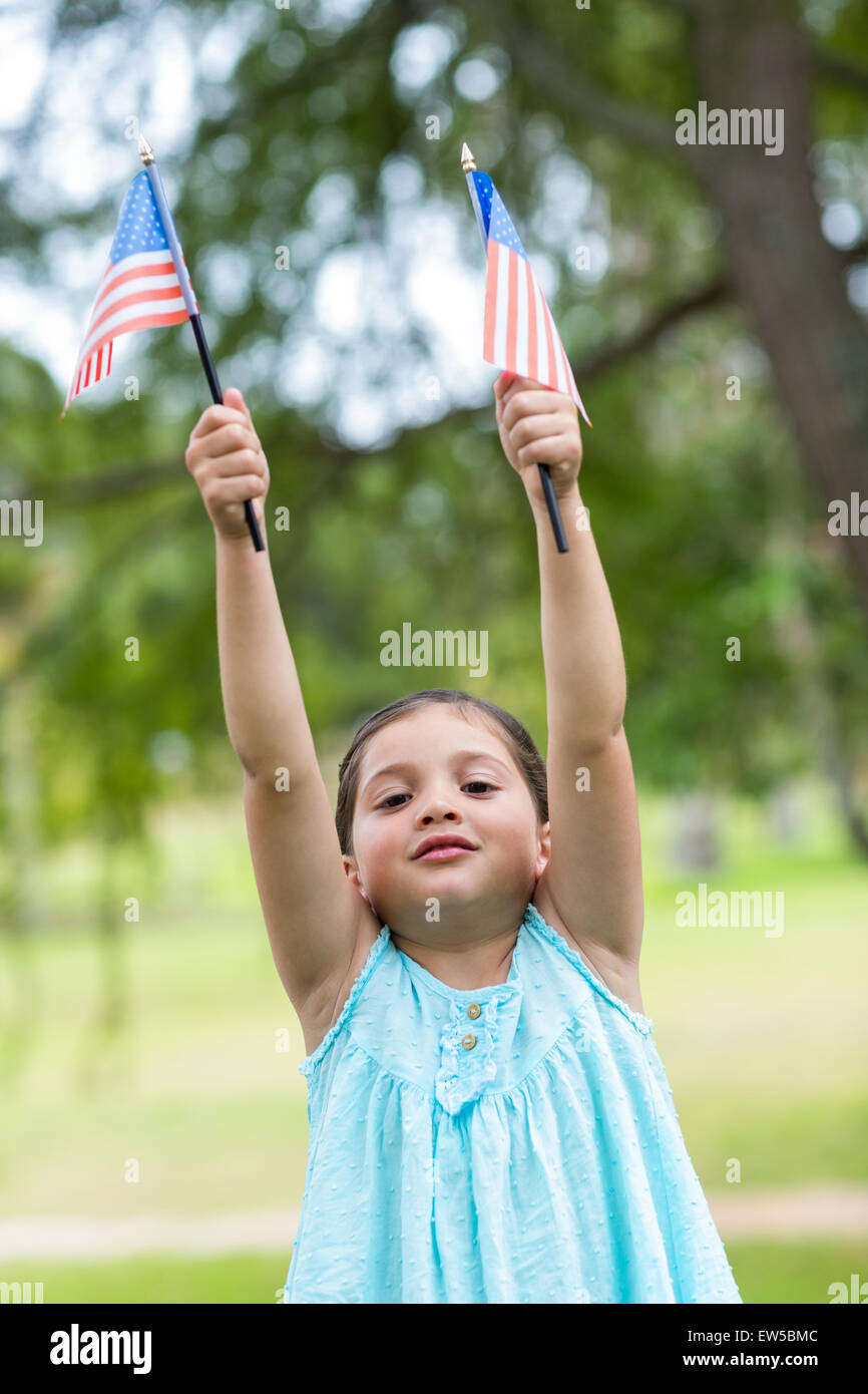 Little girl waving american flag Stock Photo