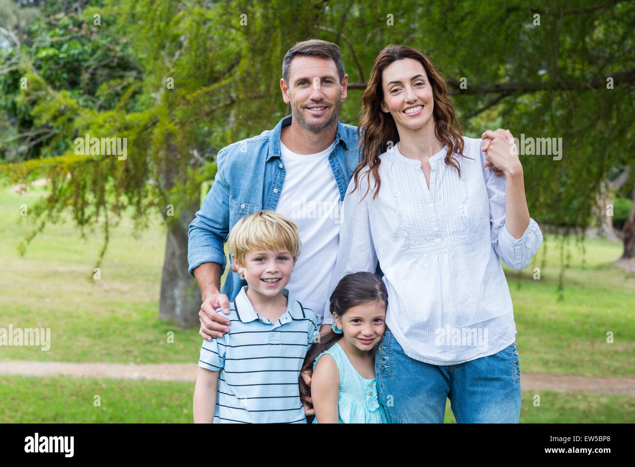 Happy family in the park together Stock Photo