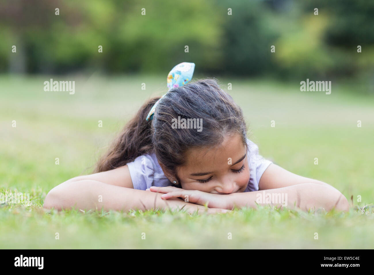Little girl sleeping in a park Stock Photo Alamy