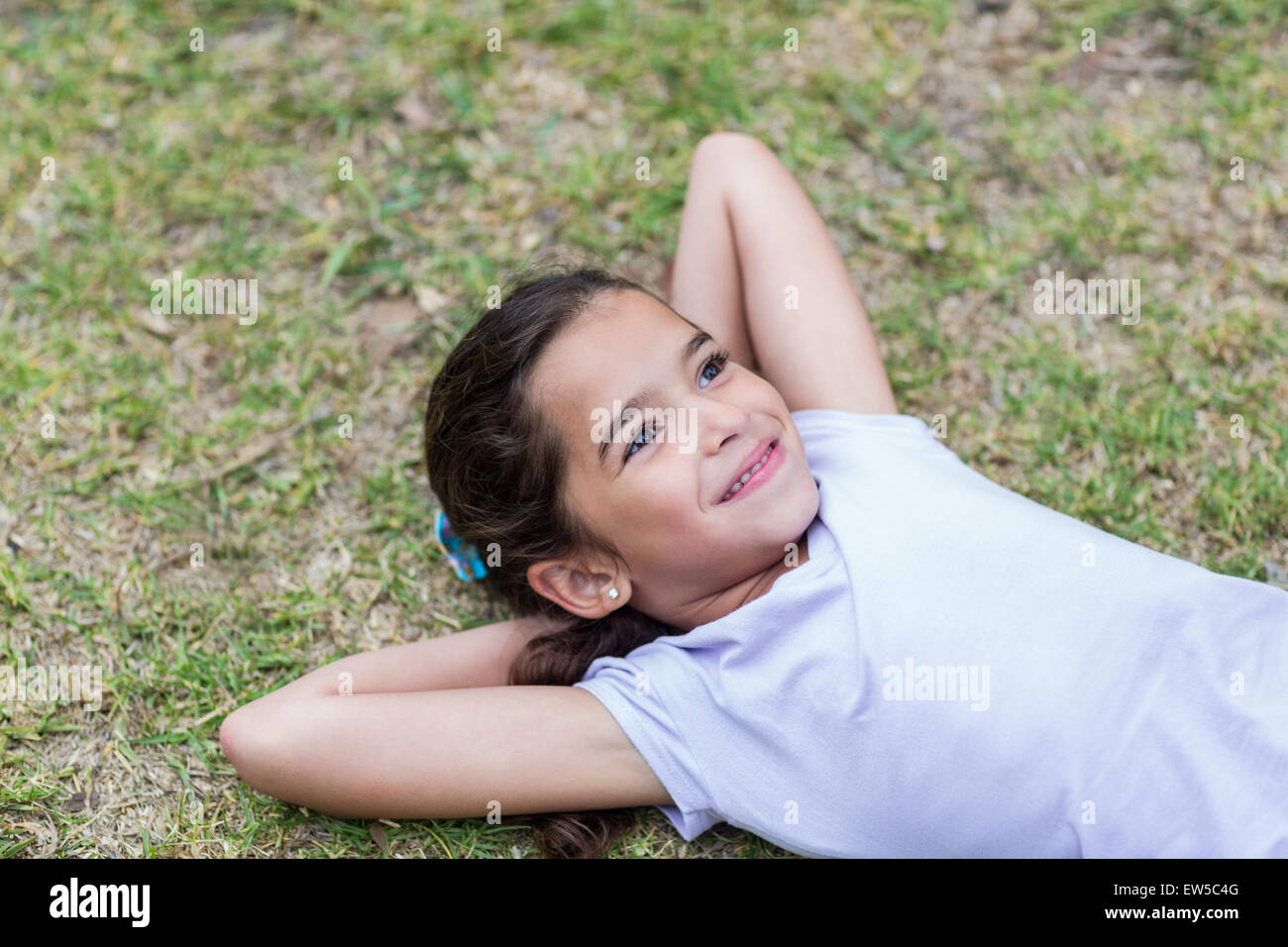 Little girl smiling at the camera Stock Photo - Alamy