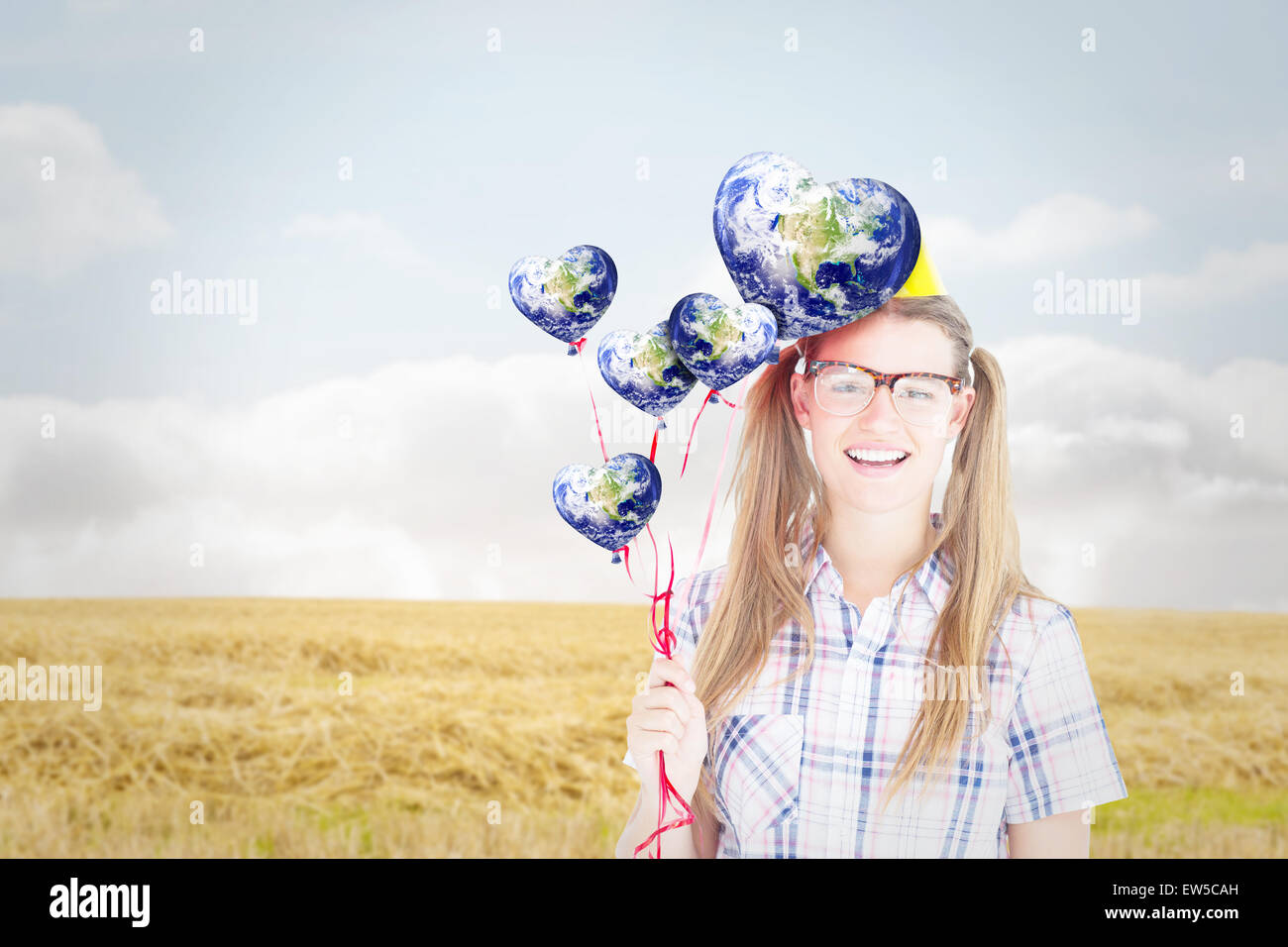 Composite image of geeky hipster smiling at camera and holding red ...