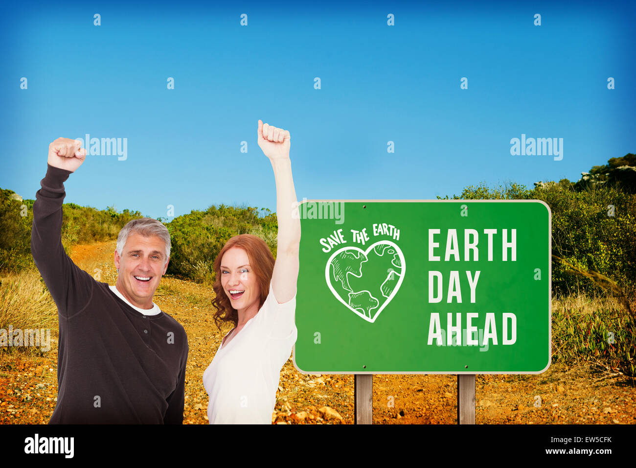 Composite image of casual couple cheering at camera Stock Photo - Alamy