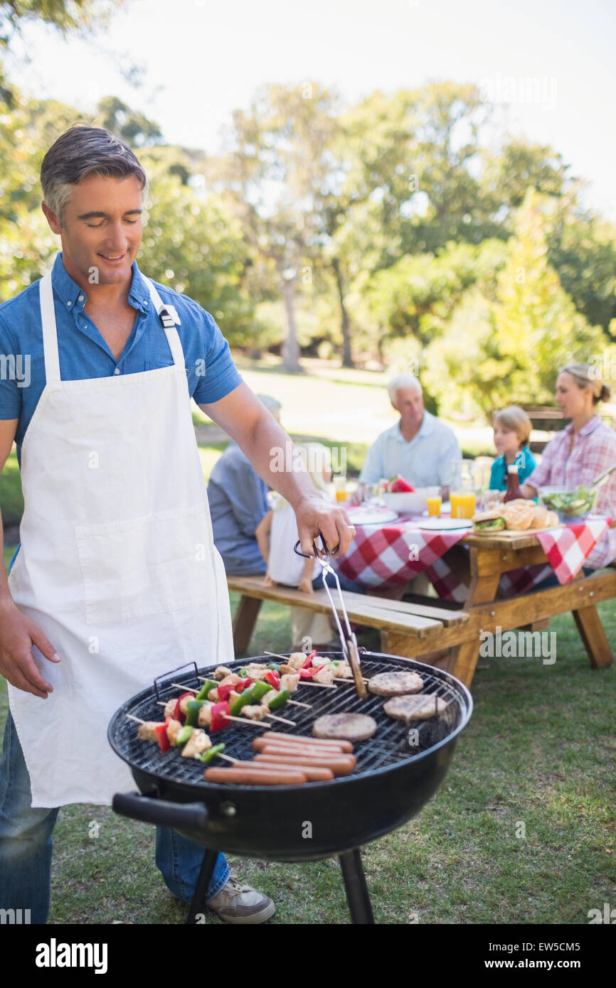 Happy man doing barbecue family hi res stock photography and images Alamy