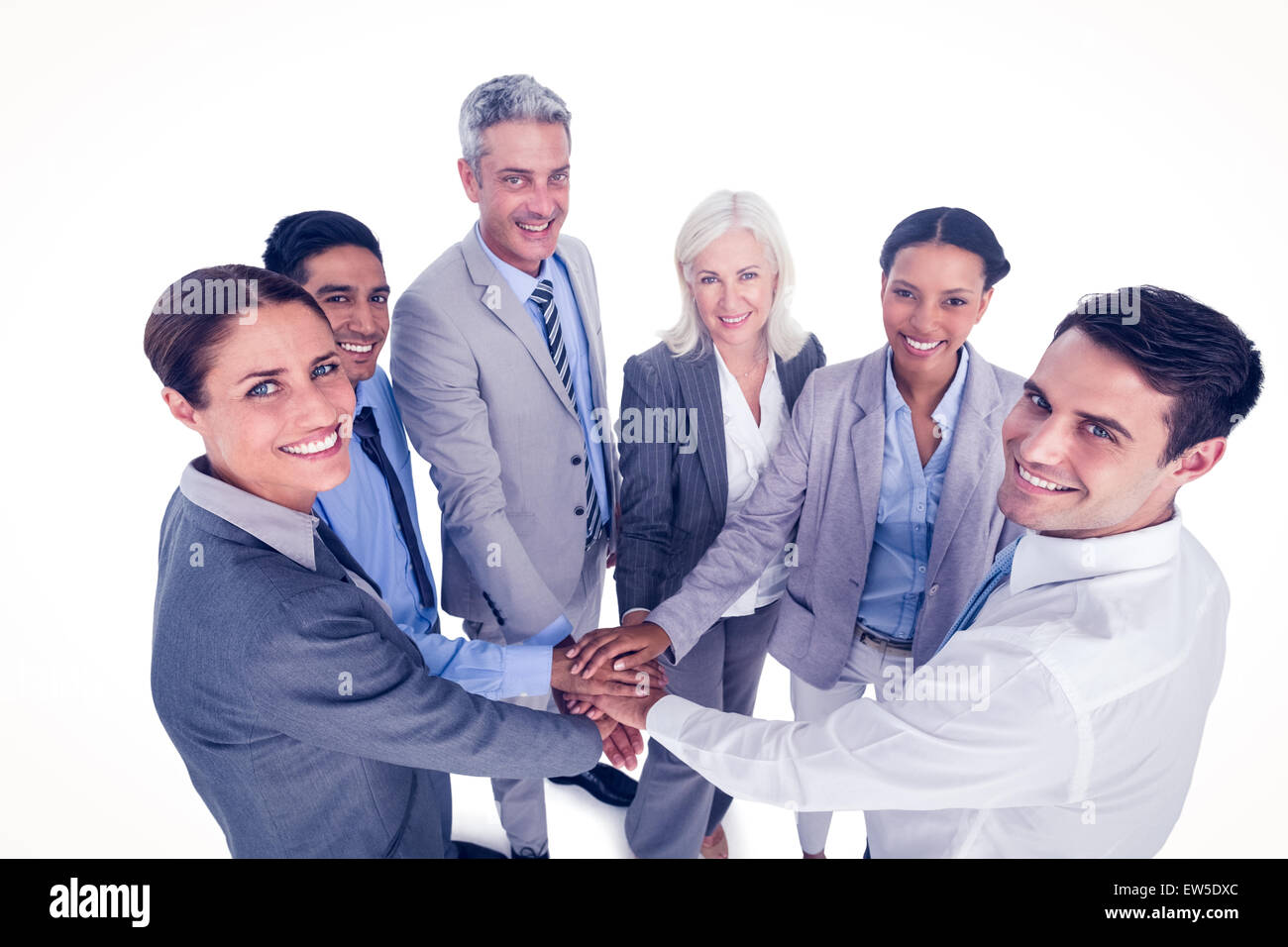 Executives holding hands together Stock Photo