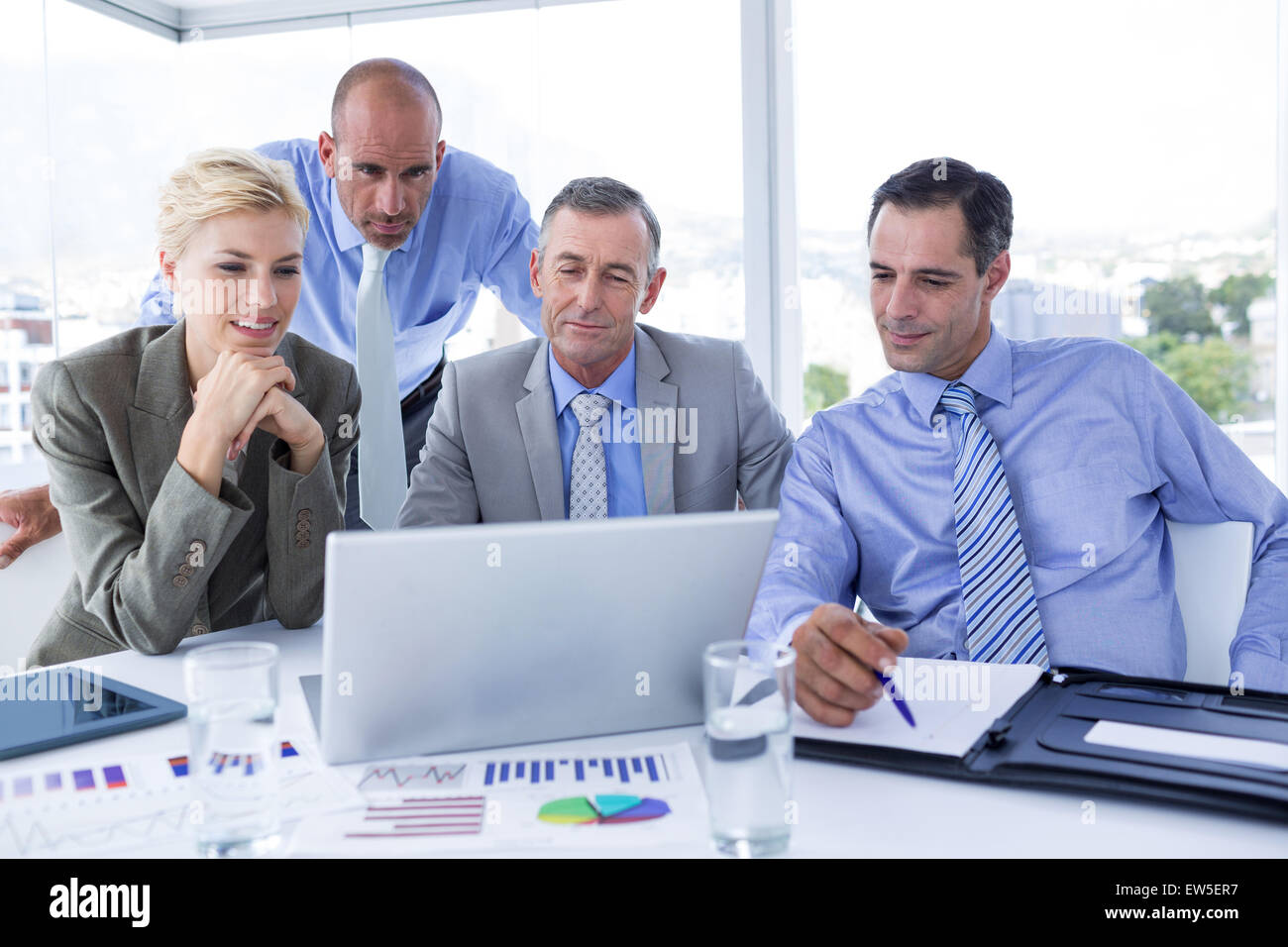 Business team working together on laptop Stock Photo - Alamy