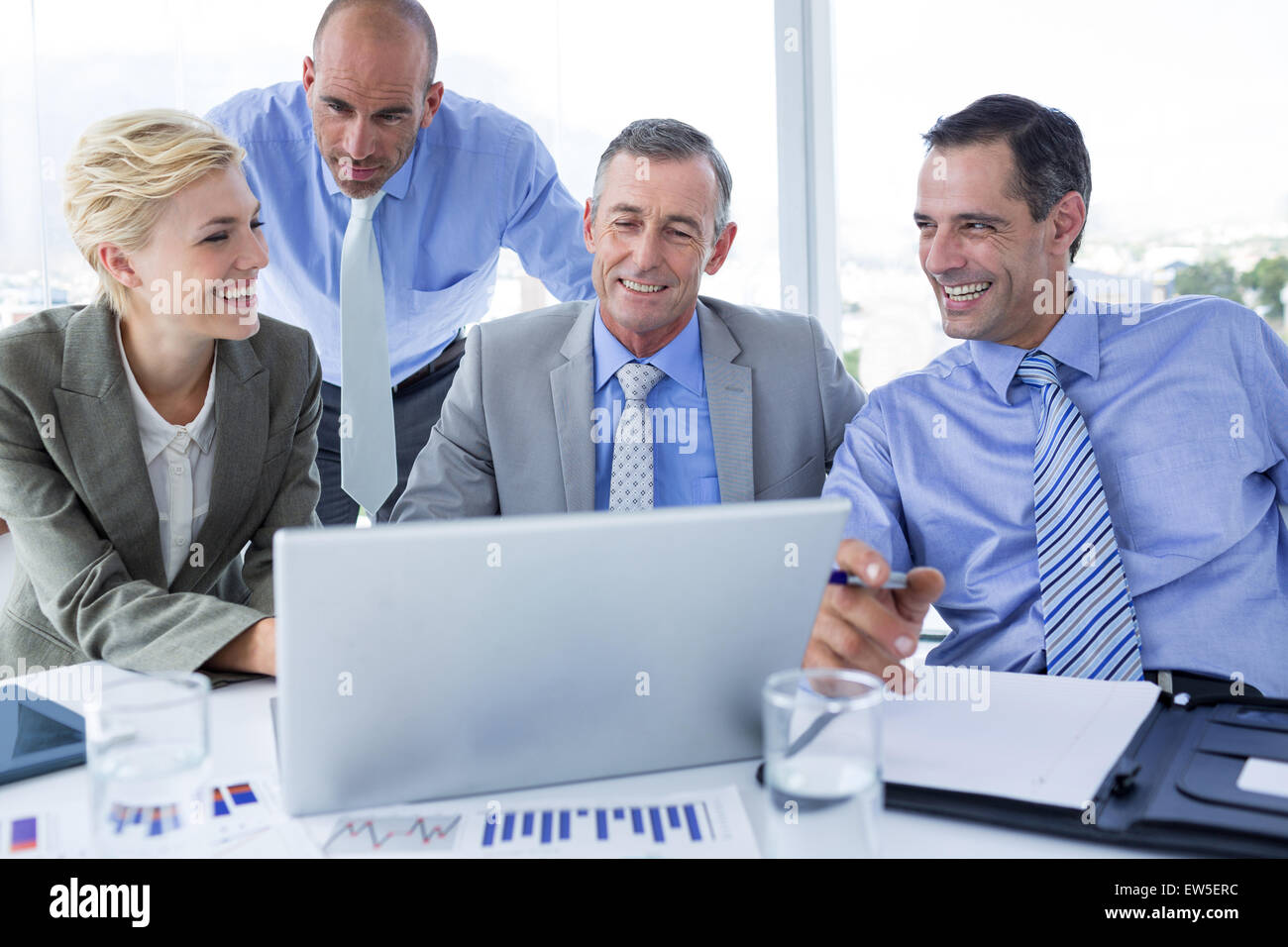 Business team working together on laptop Stock Photo - Alamy