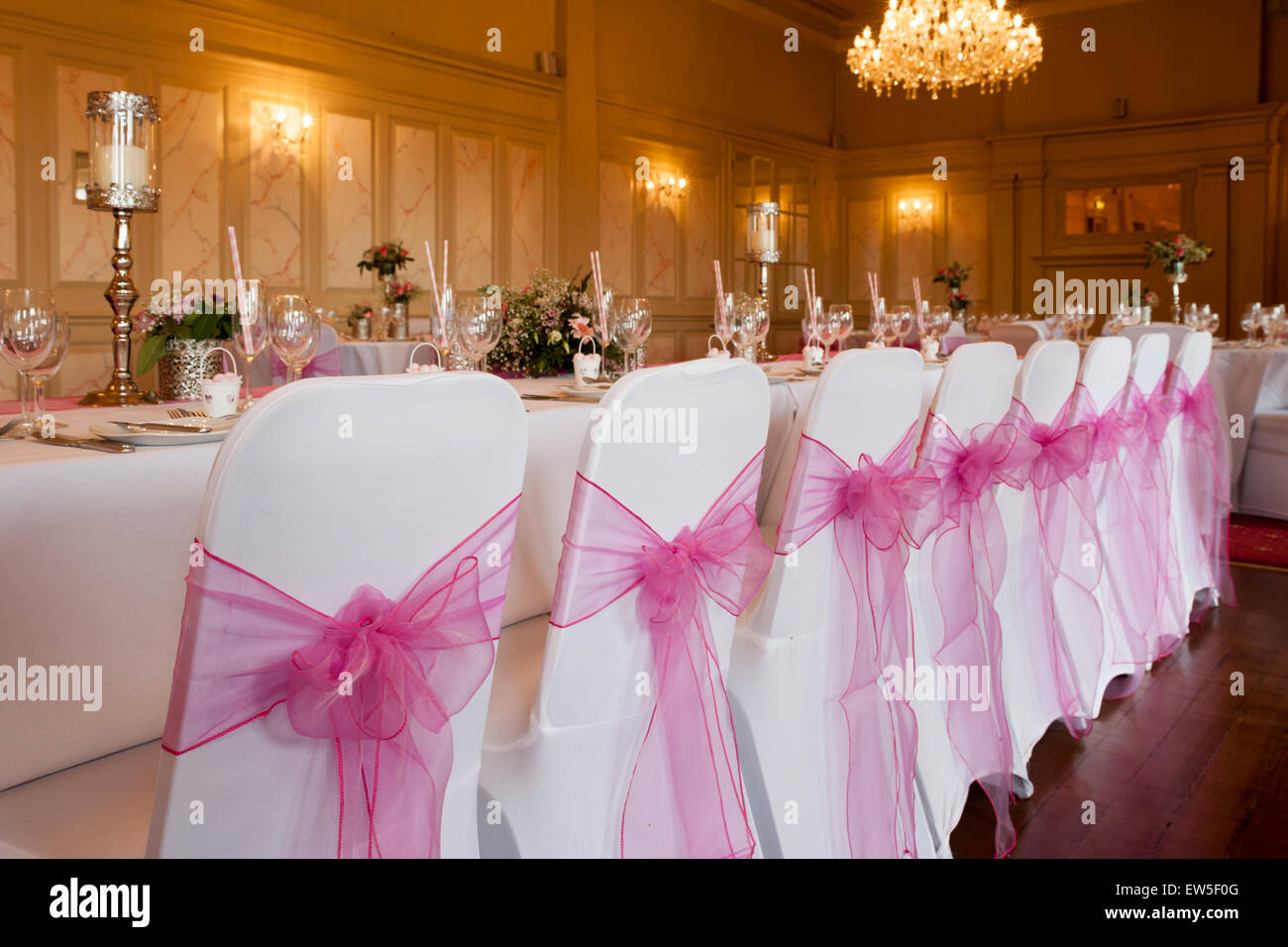 Wedding Top Table Place Settings And Chairs With Bows Stock Photo