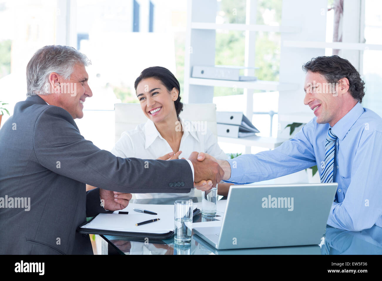 Business people reaching an agreement Stock Photo