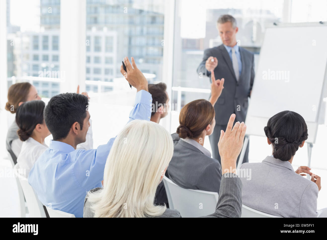 Business people raising their arms during meeting Stock Photo Alamy