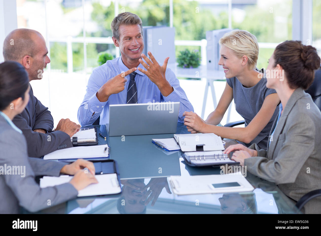 Business team smiling at camera Stock Photo - Alamy