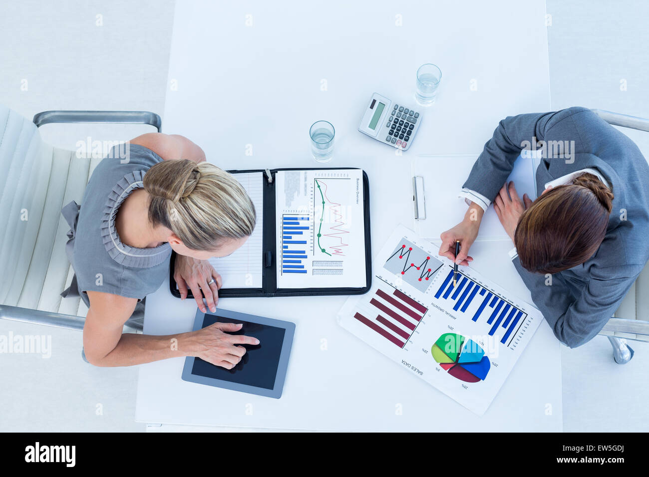 Businesswomen working together Stock Photo - Alamy