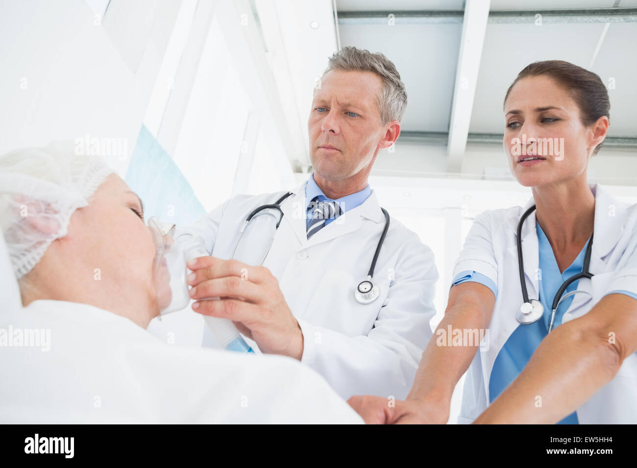 Doctor putting an oxygen mask Stock Photo Alamy