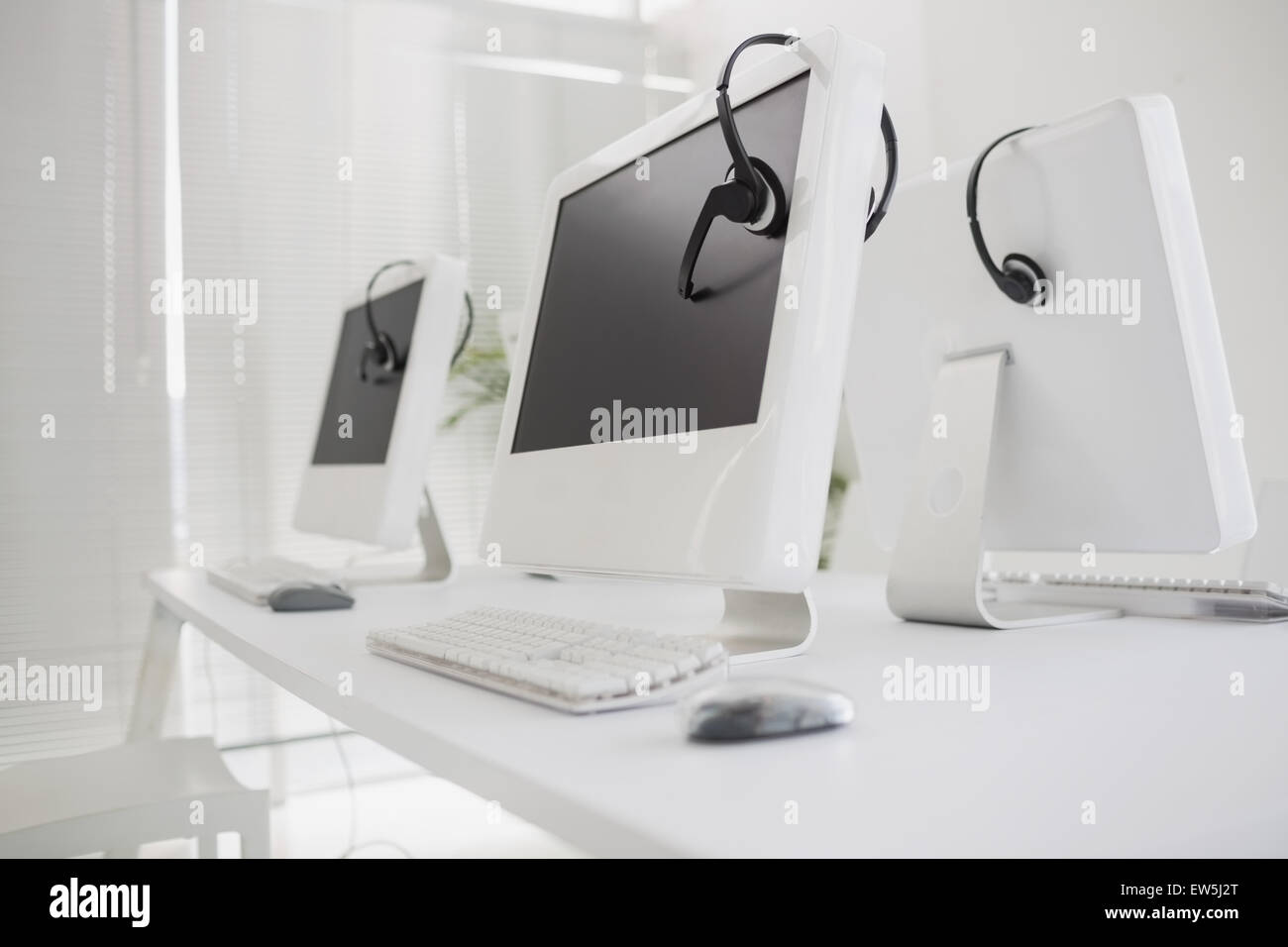Computers and headsets Stock Photo Alamy