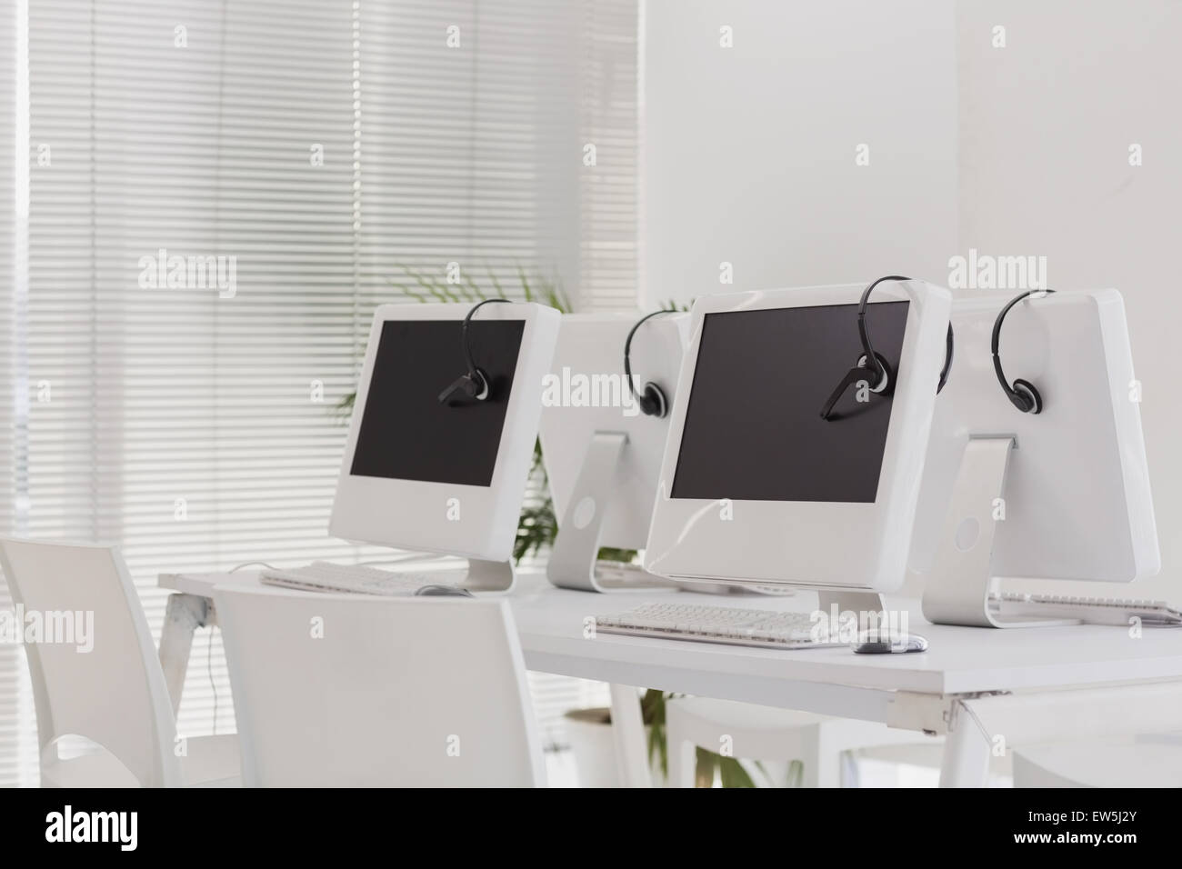 Computers and headsets Stock Photo Alamy