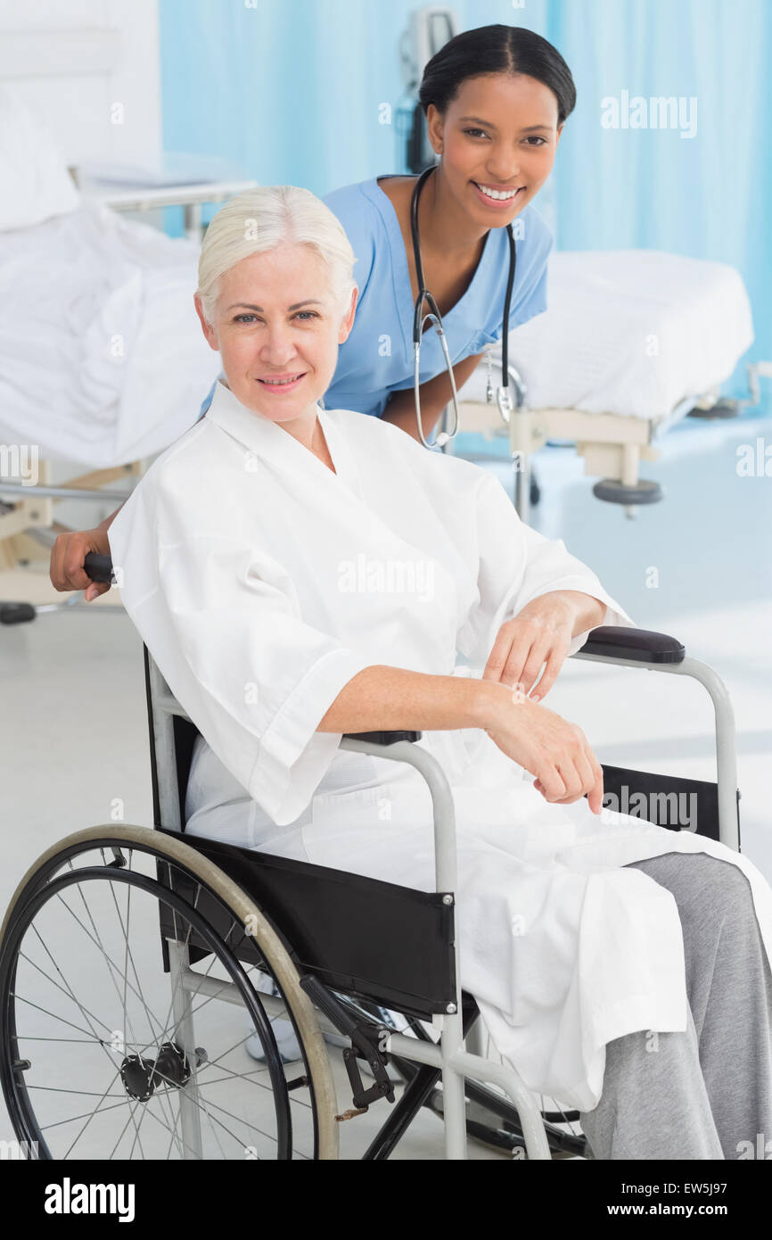 doctors and patient in wheelchair Stock Photo Alamy