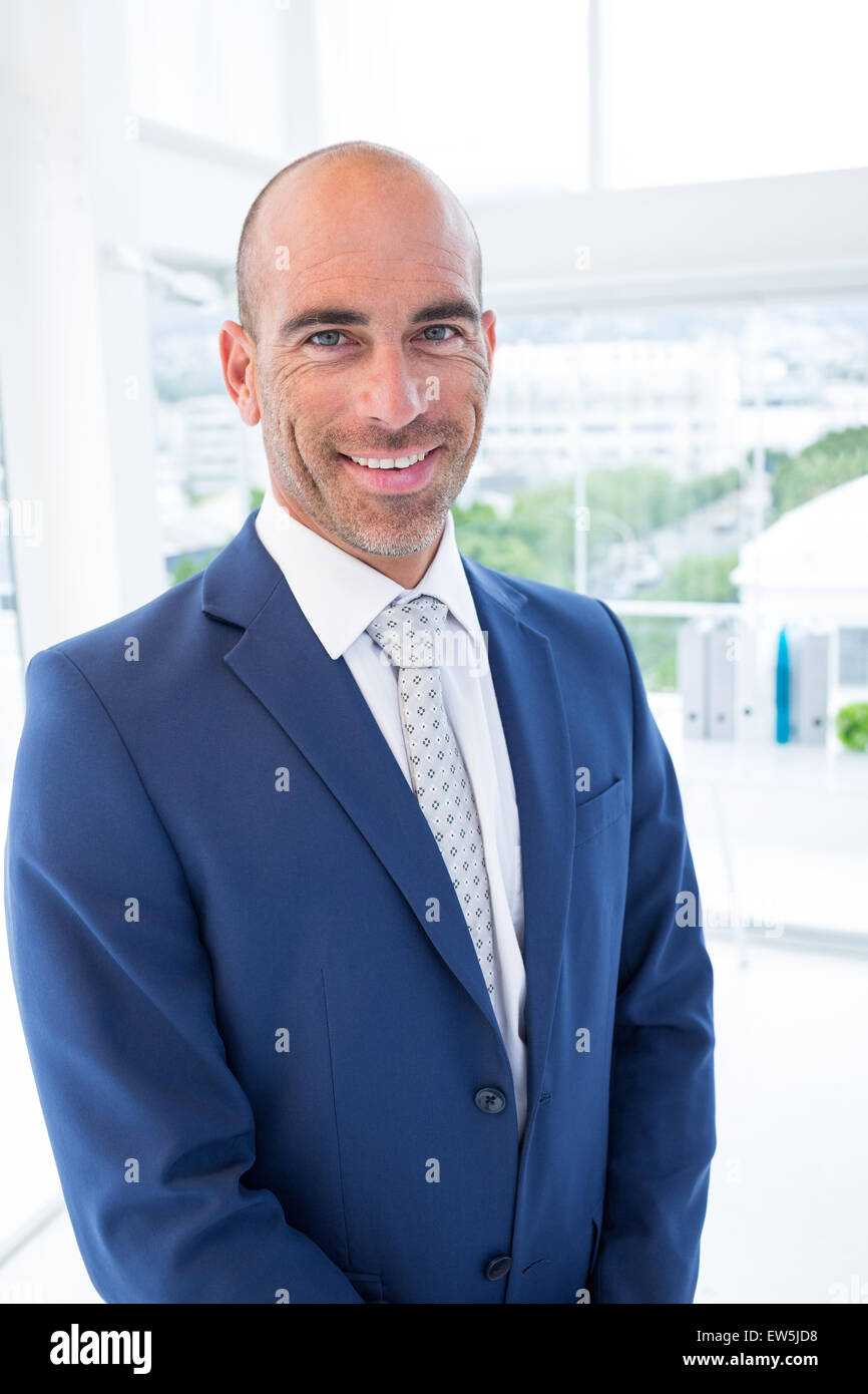 Businessman smiling at the camera Stock Photo - Alamy