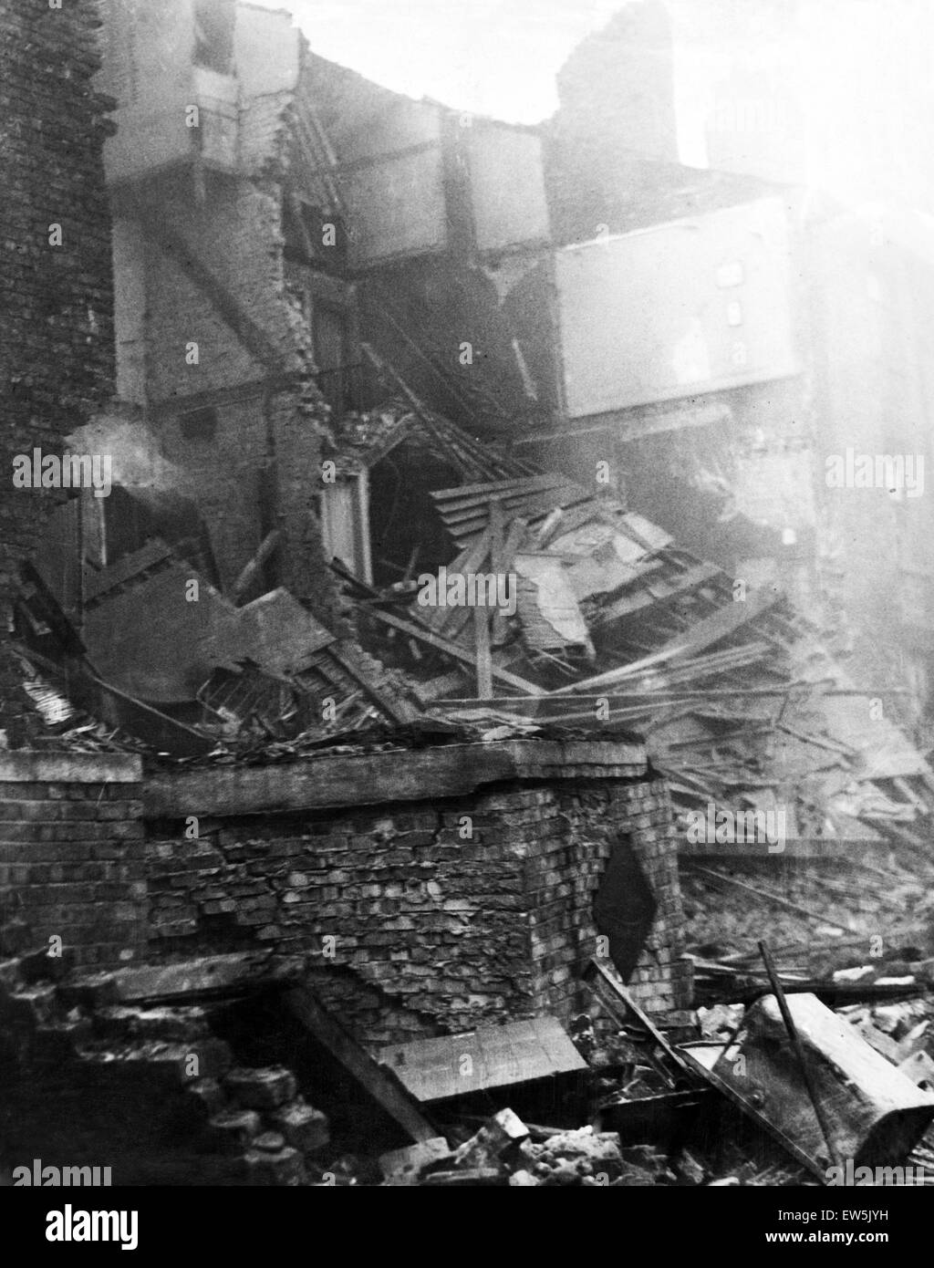 Bomb damage in Upper Canning Street, Liverpool. The shelters shown in the foreground were only slightly damaged and their occupants unhurt, when a high explosive bomb damaged houses converted into flats during a raid on 27th October 1940. 28th October 194 Stock Photo