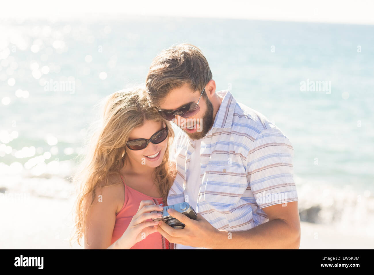 happy couple looking at their camera Stock Photo - Alamy