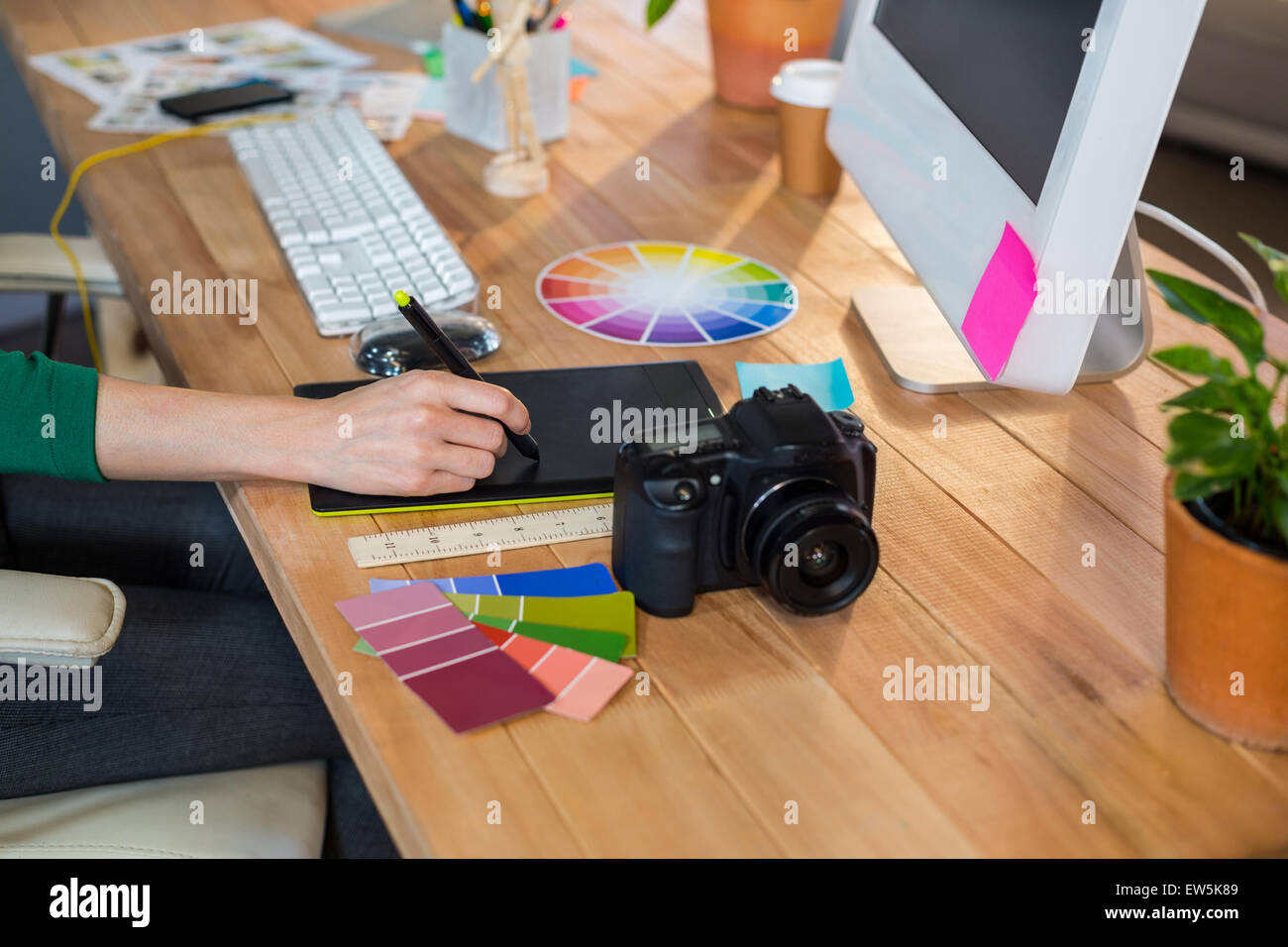 Designer working with colour wheel and digitizer Stock Photo