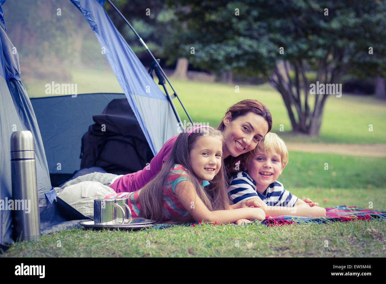 Mother and children camping in the park Stock Photo