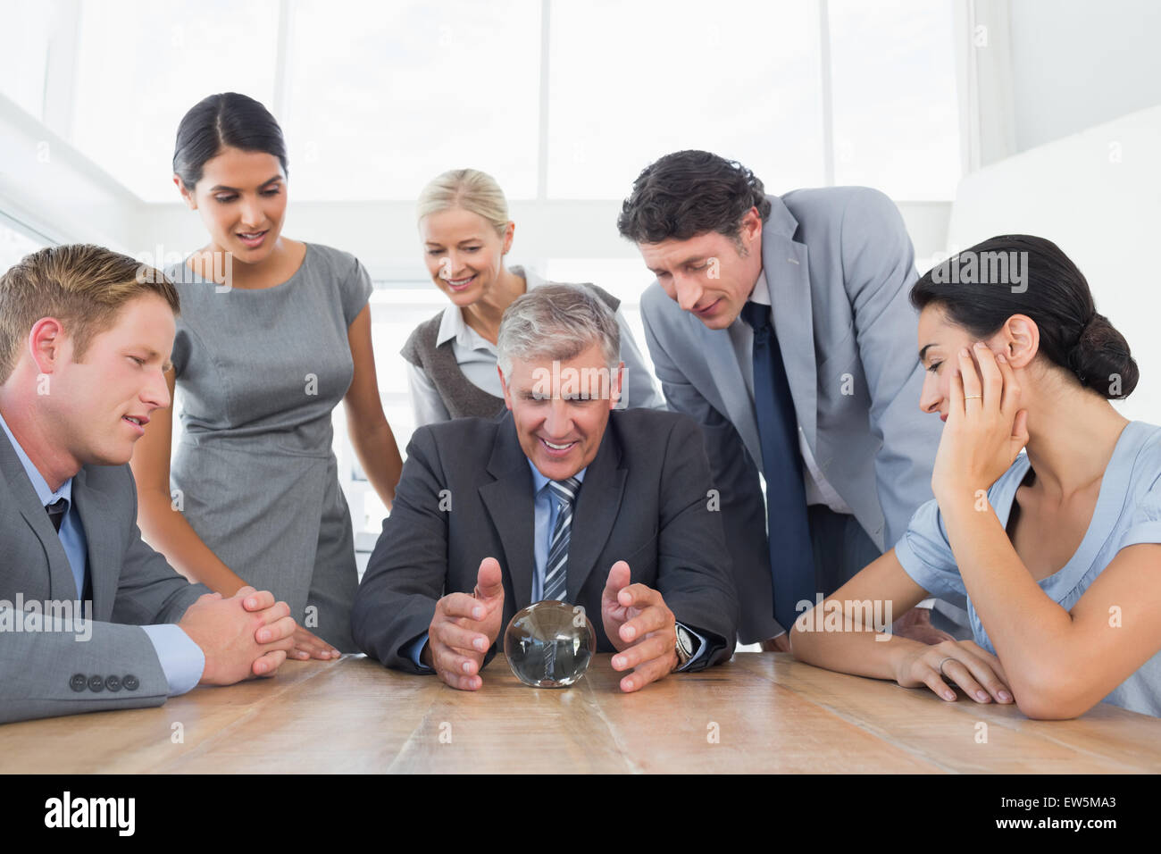 Businessman forecasting the future with his crystal ball Stock Photo ...
