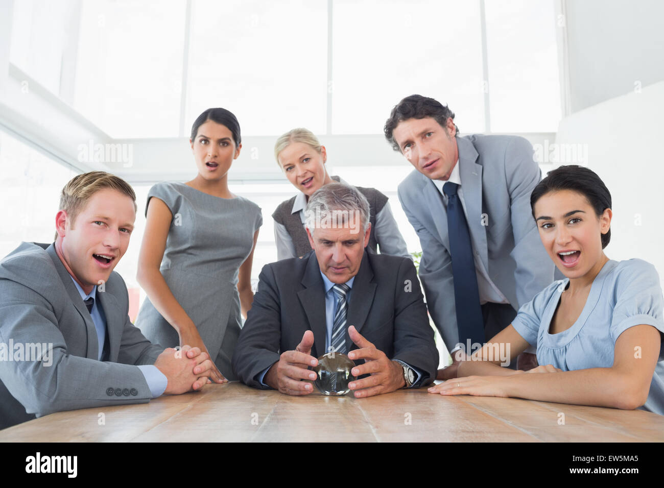 Businessman forecasting the future with his crystal ball Stock Photo ...
