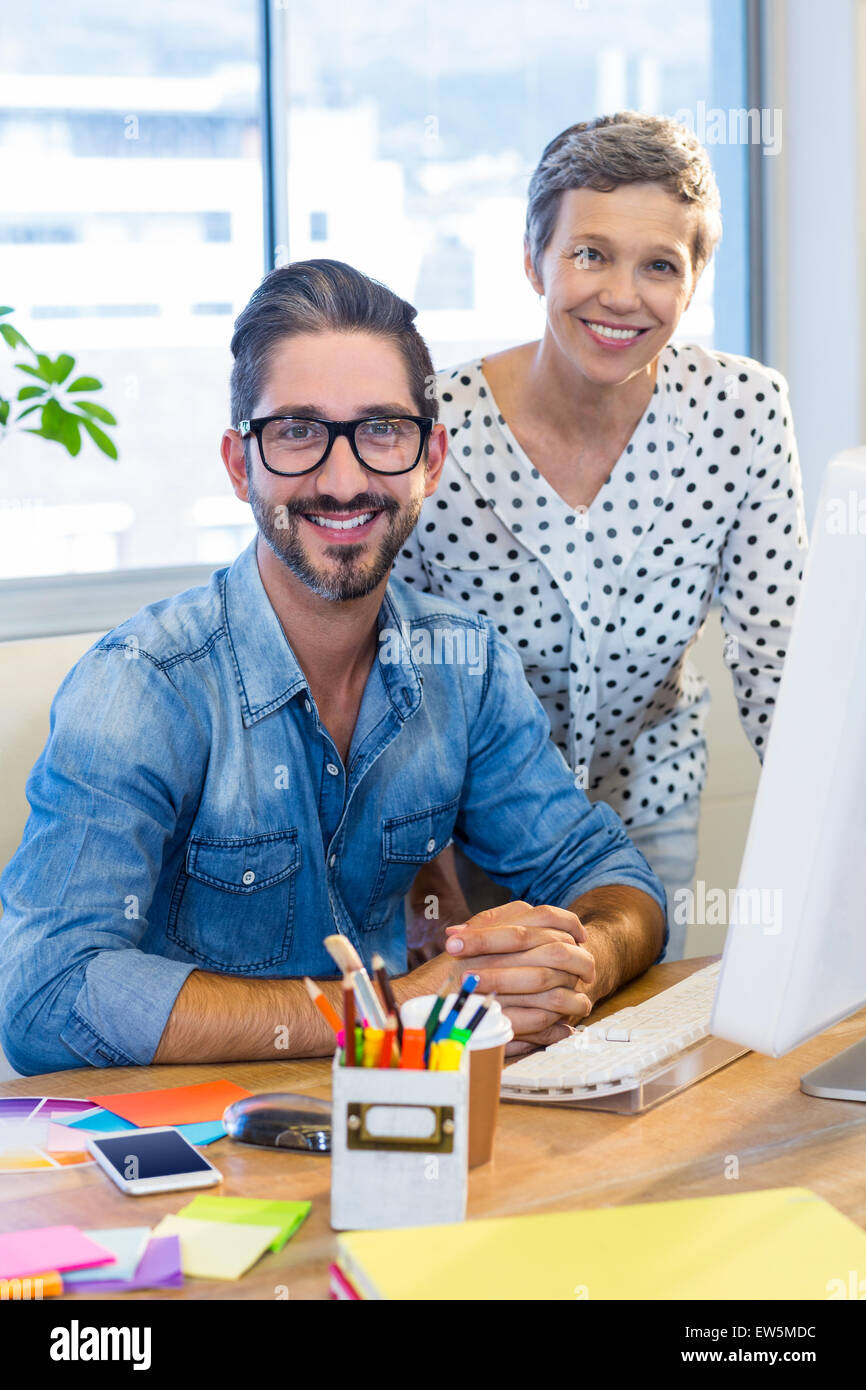 Casual business team smiling at camera Stock Photo - Alamy