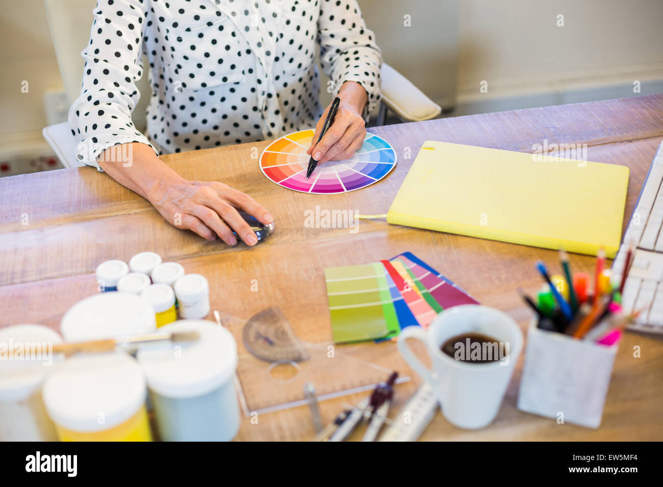 Casual businesswoman working with colour chart Stock Photo