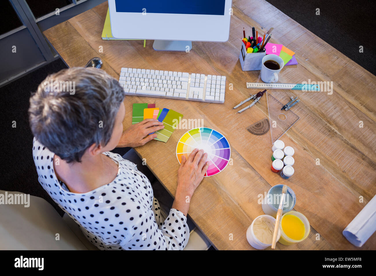 Casual businesswoman working with colour chart Stock Photo