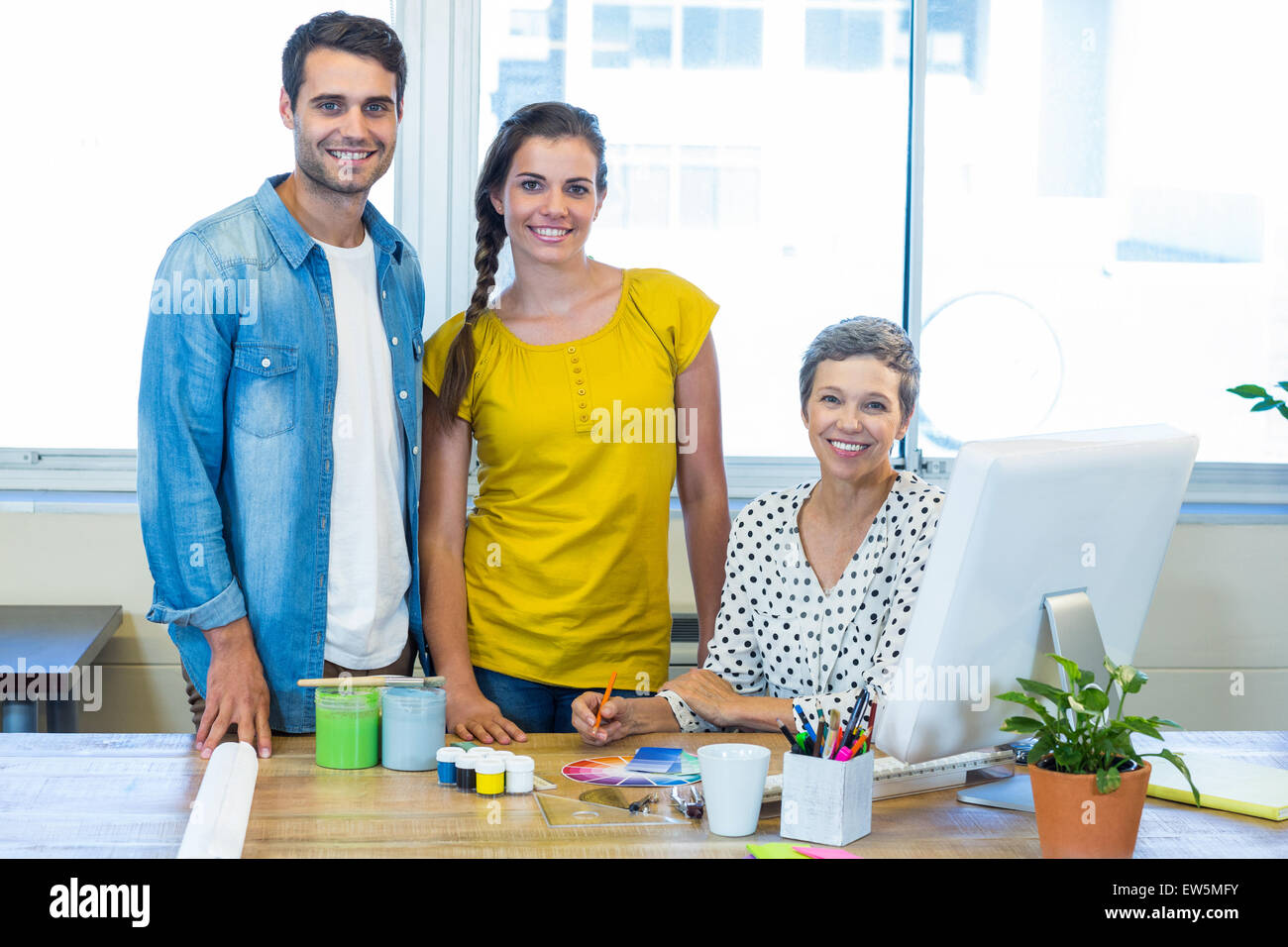 Casual business team smiling at camera during meeting Stock Photo