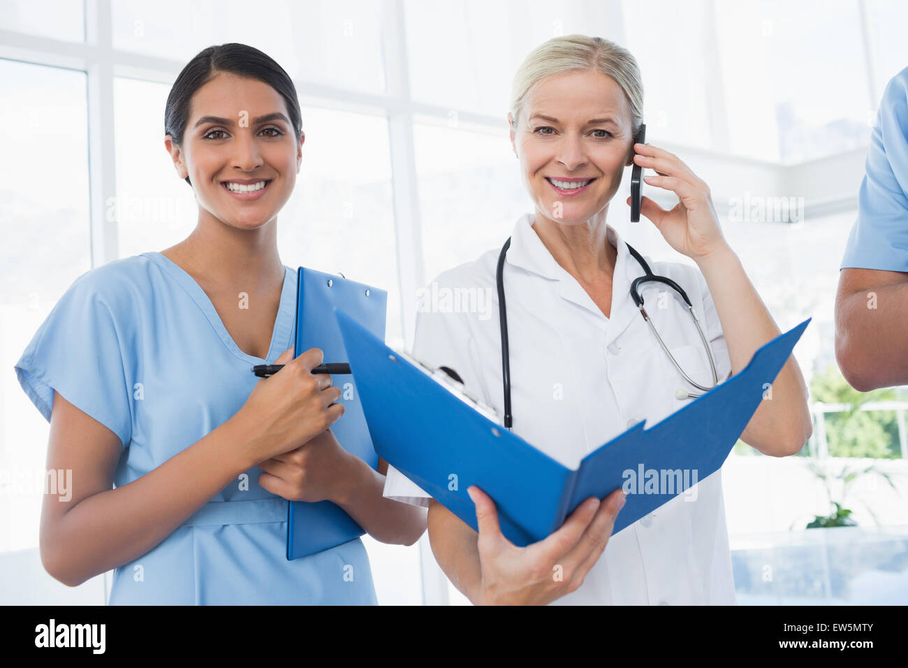 Doctor holding folder hi-res stock photography and images - Alamy