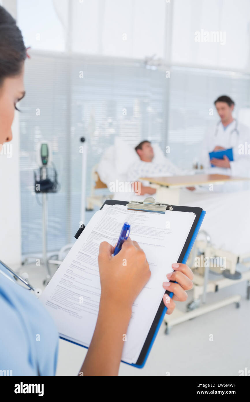 Doctors taking care of patient Stock Photo Alamy