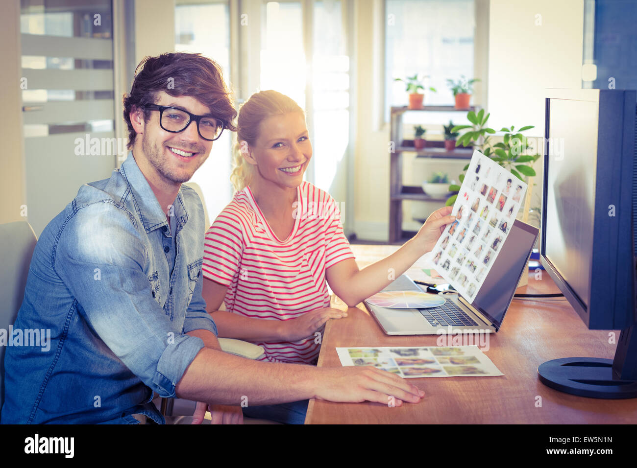 Happy designers working together Stock Photo