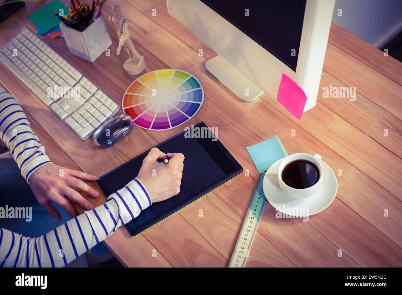 Designer using digitizer on desk Stock Photo