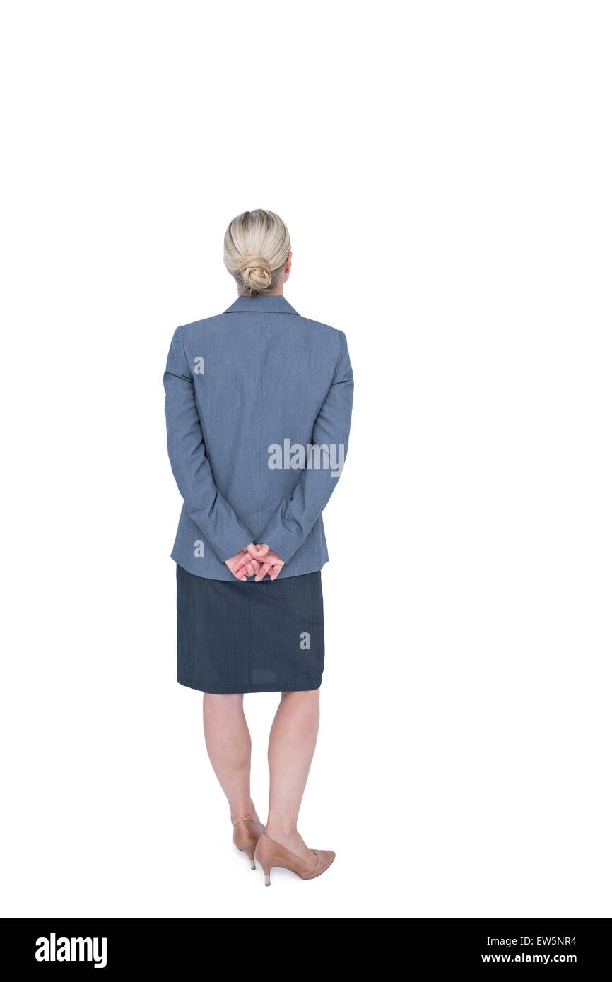Businesswoman standing with hands behind back Stock Photo Alamy