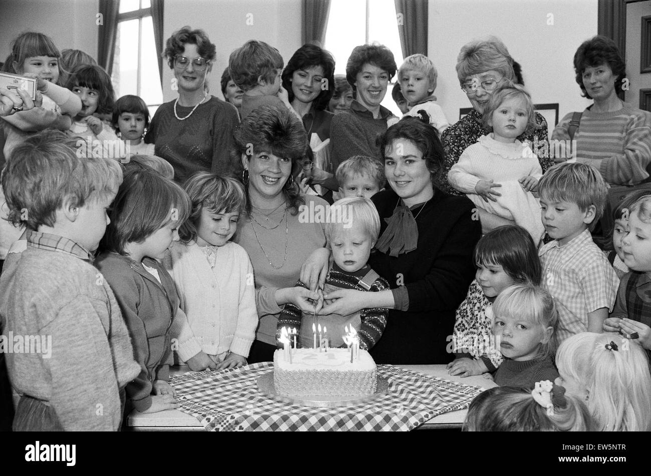 Cowcliffe Playgroup has come of age – and a special party was held for its 21st birthday. Pictured cutting the cake, made by one of the mums, Mrs Dorothy Pearce, are Mrs Helen Hawkyard (left) and Mrs Susan Frain, members of the playgroup when it was found Stock Photo