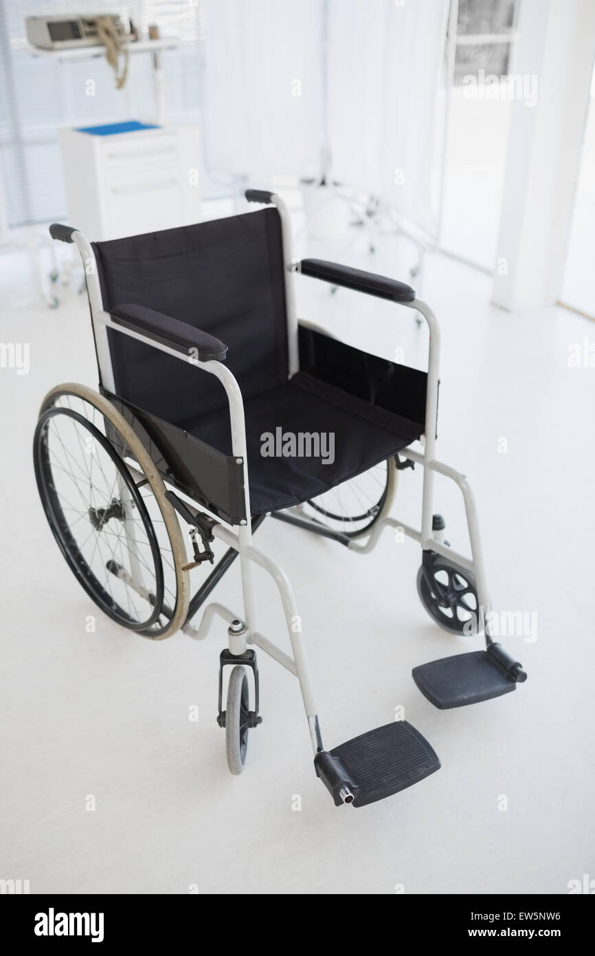 Black wheelchair in hospital Stock Photo Alamy