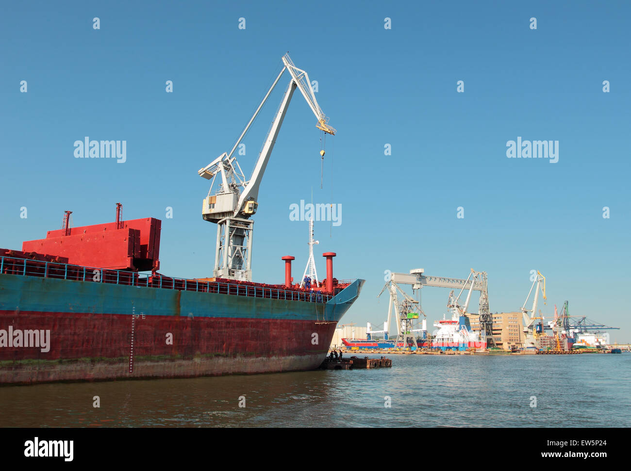 Shipyard in Gdynia, Poland. Cranes working in port. Stock Photo