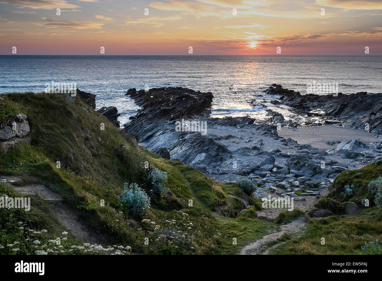 Evening light on the rugged coast of Newquay in Cornwall. Stock Photo