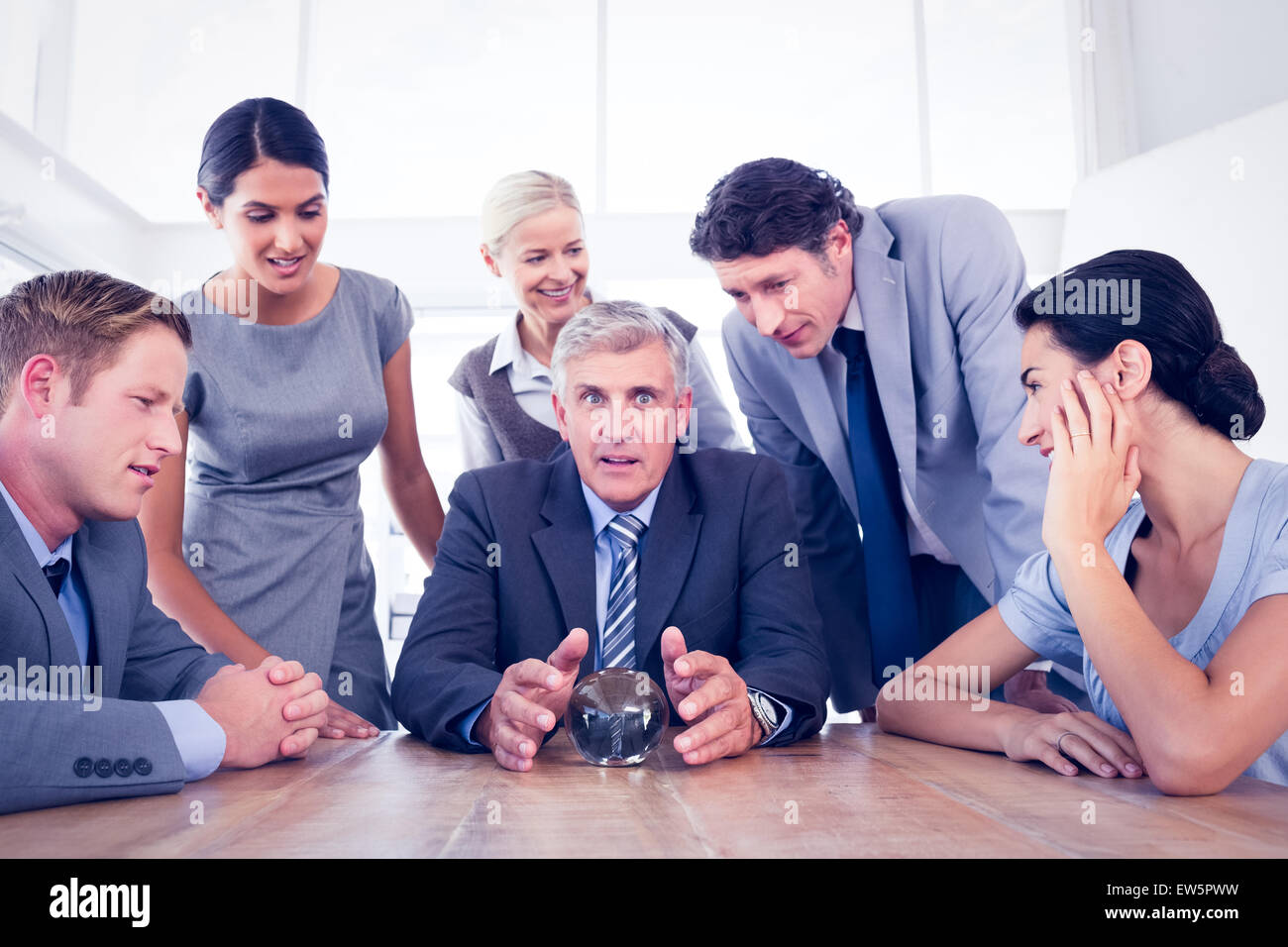 Businessman forecasting the future with his crystal ball Stock Photo ...