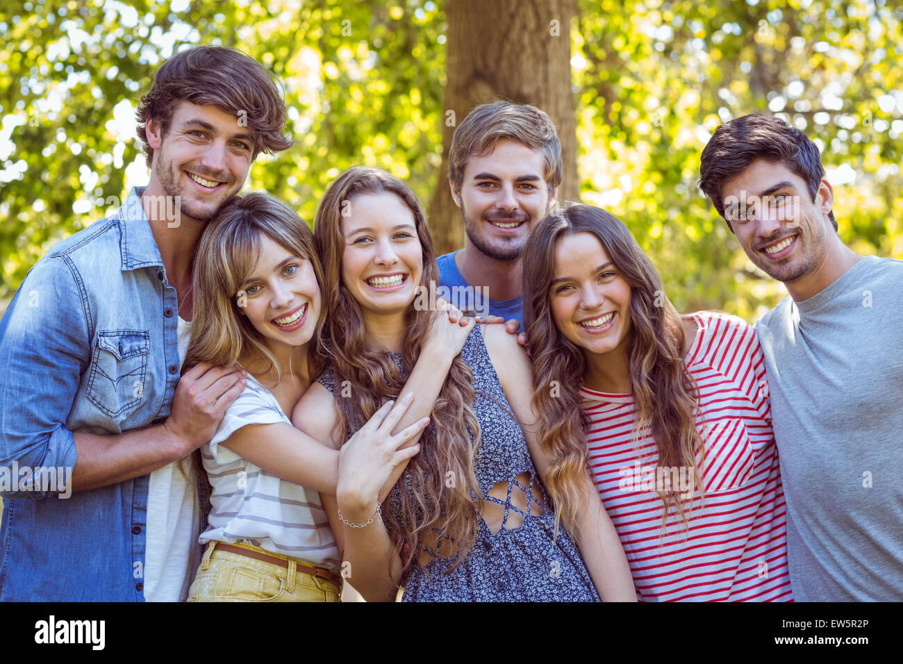 Happy friends in the park Stock Photo - Alamy