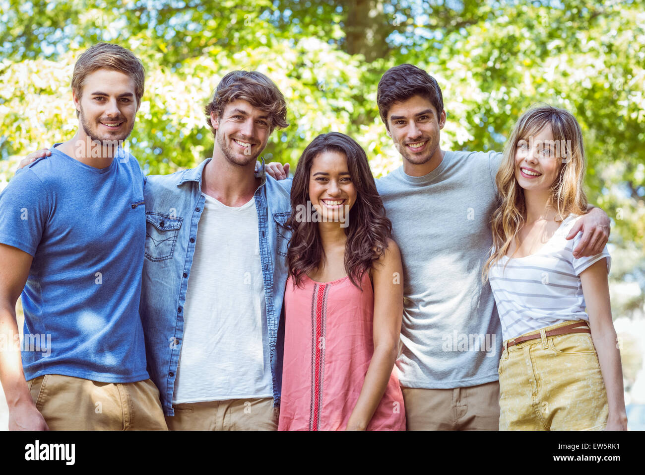 Happy friends in the park Stock Photo - Alamy