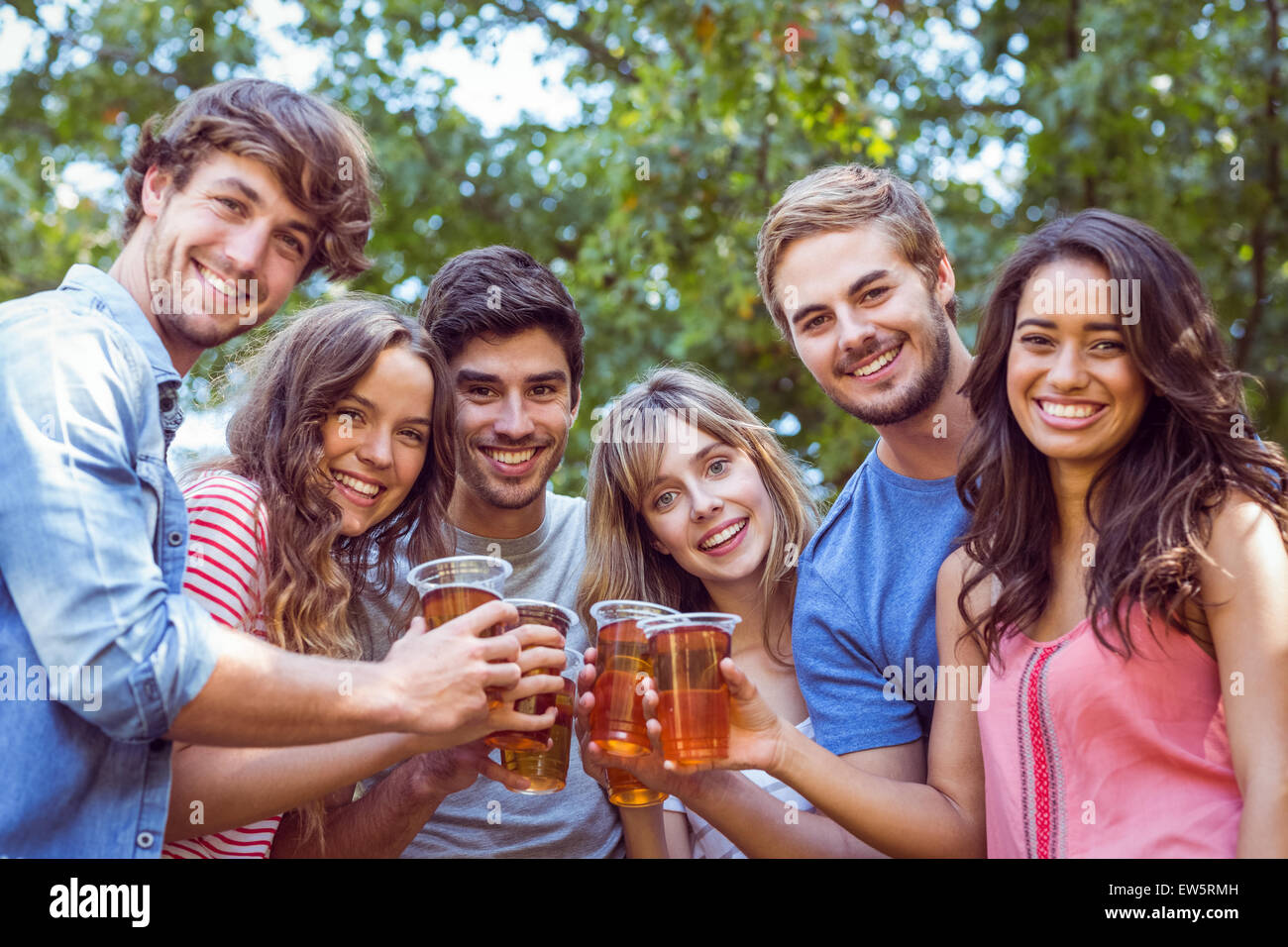 Happy friends in the park Stock Photo - Alamy